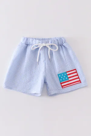 Blue patriotic flag applique seersucker boy swim trunks